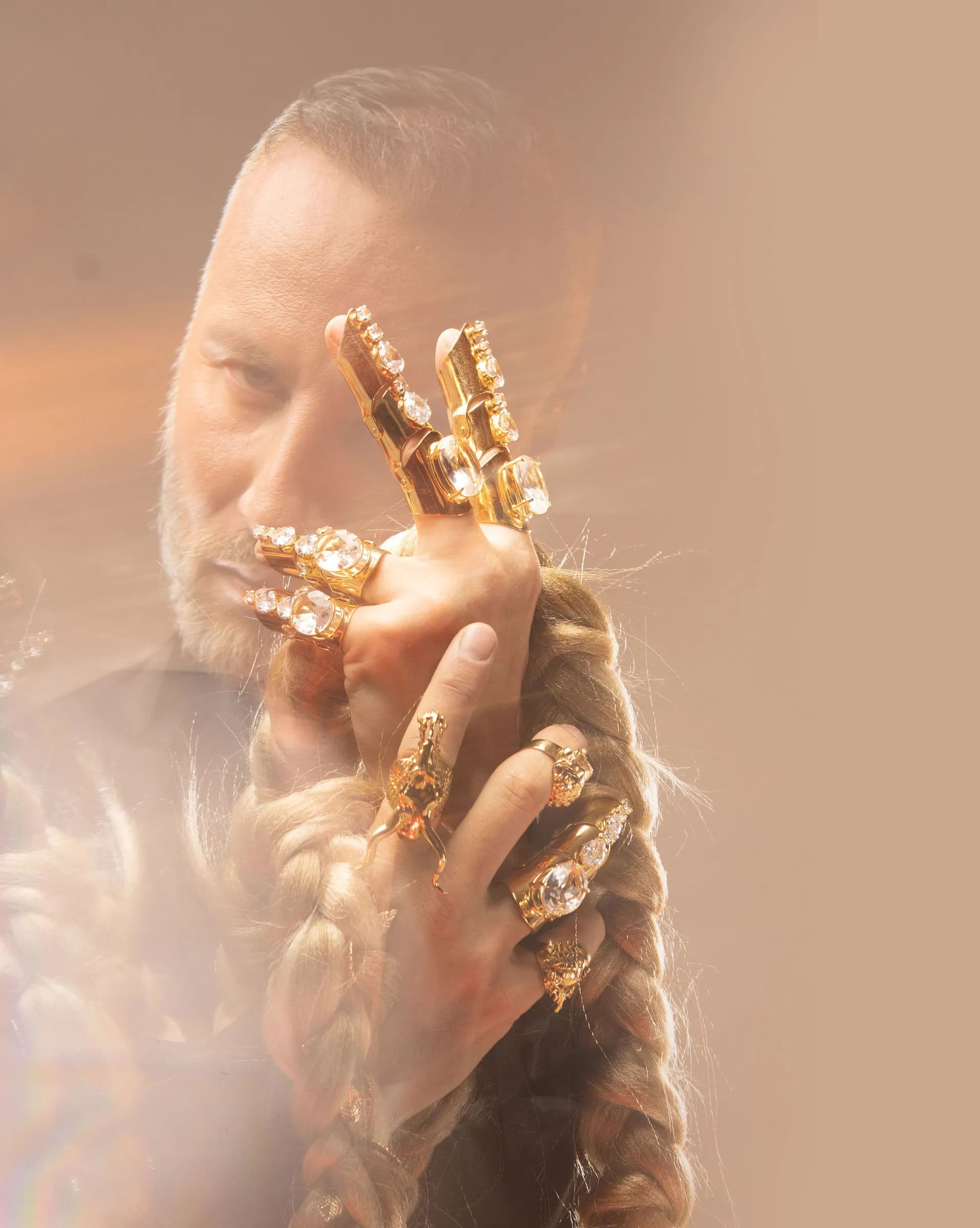 Boyko with gold jewelry styling hair